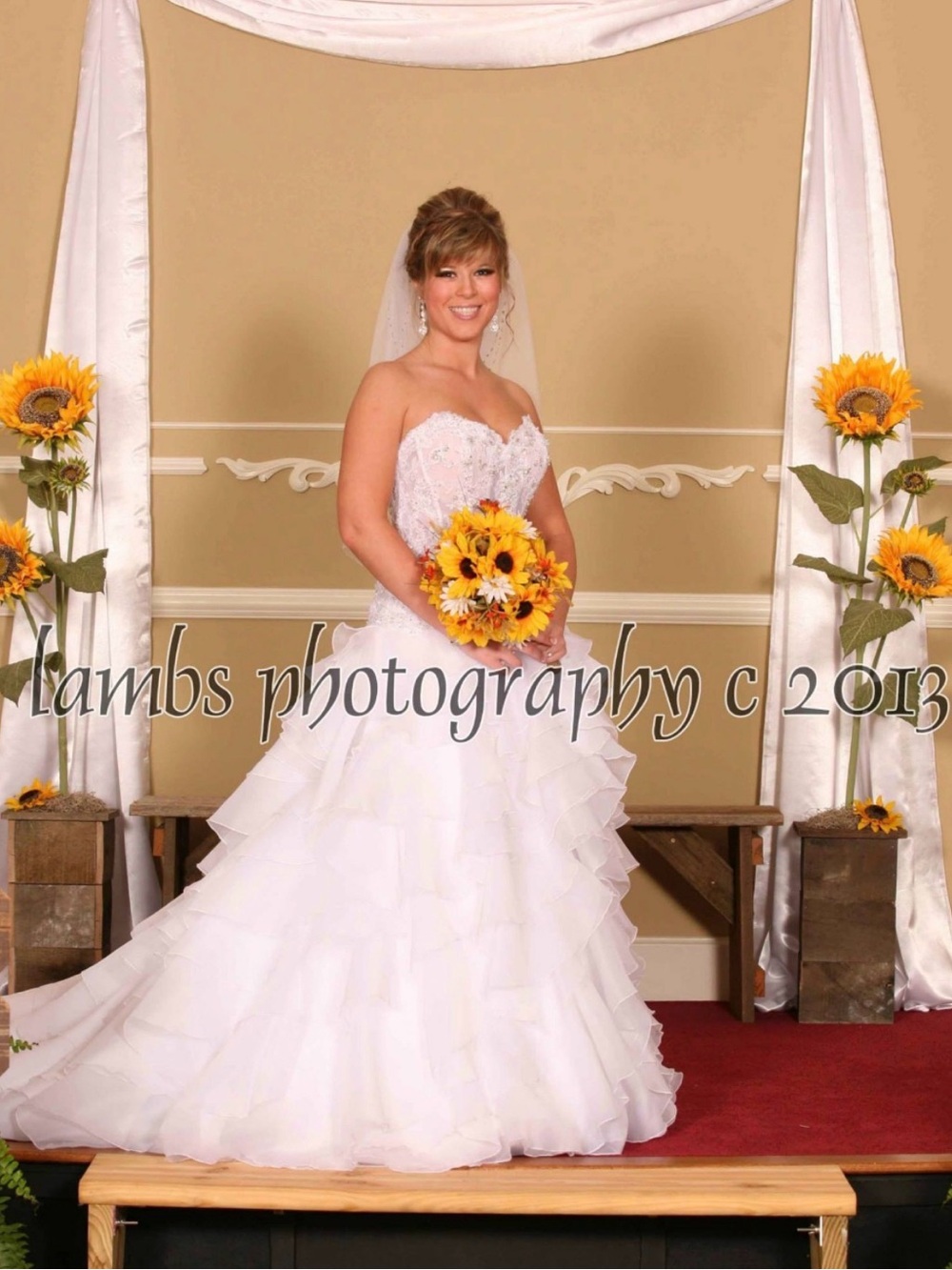 Oleg Cassini White Strapless Bridal Portrait with Sunflower Bouquet